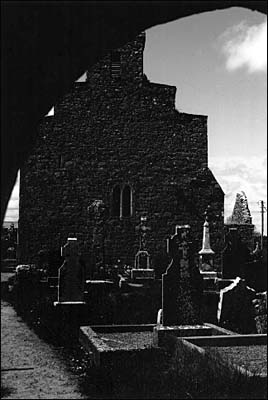 Black and white photograph of church yard at Kilfenora.