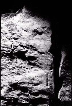 Black and white photograph of guardian stone from smaller mound at Knowth.